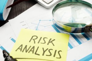 risk analysis concept. magnifying glass and business documents.