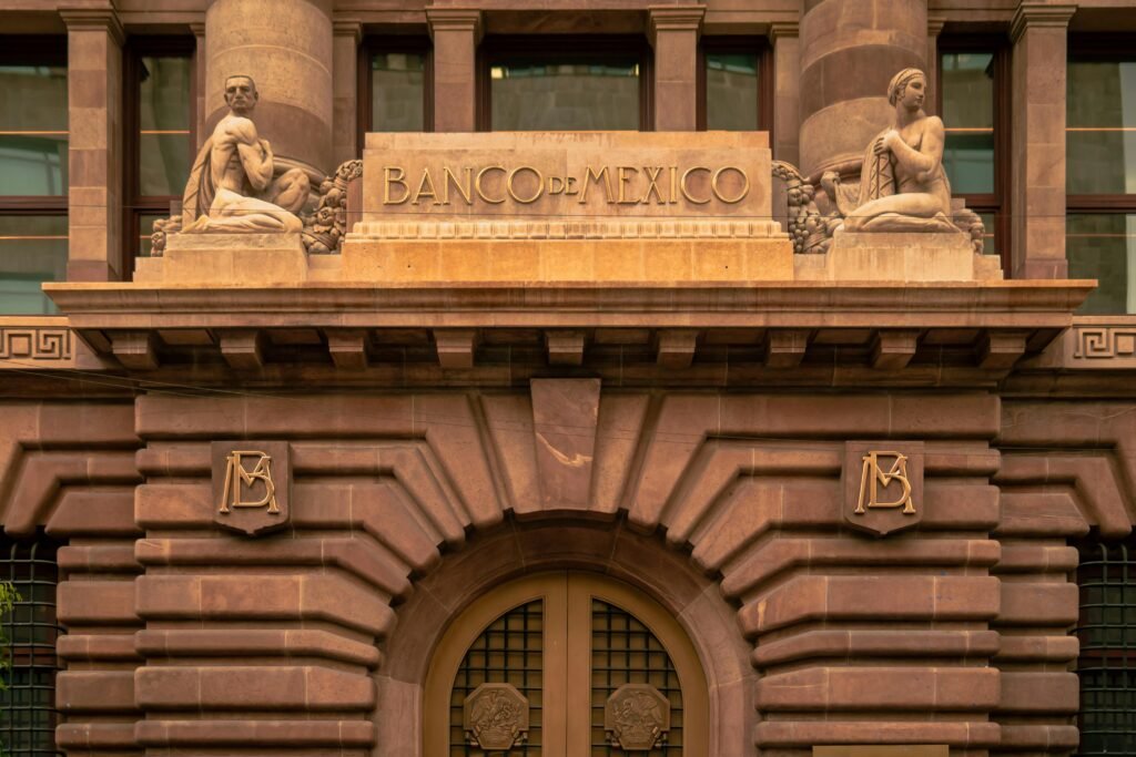 Elegant architectural facade of Banco de Mexico with classical sculptures in Mexico City.